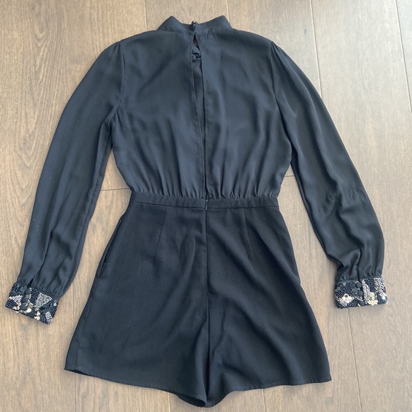 Long Sleeved Black Romper with Embellished Cuffs - Picture 5 of 6